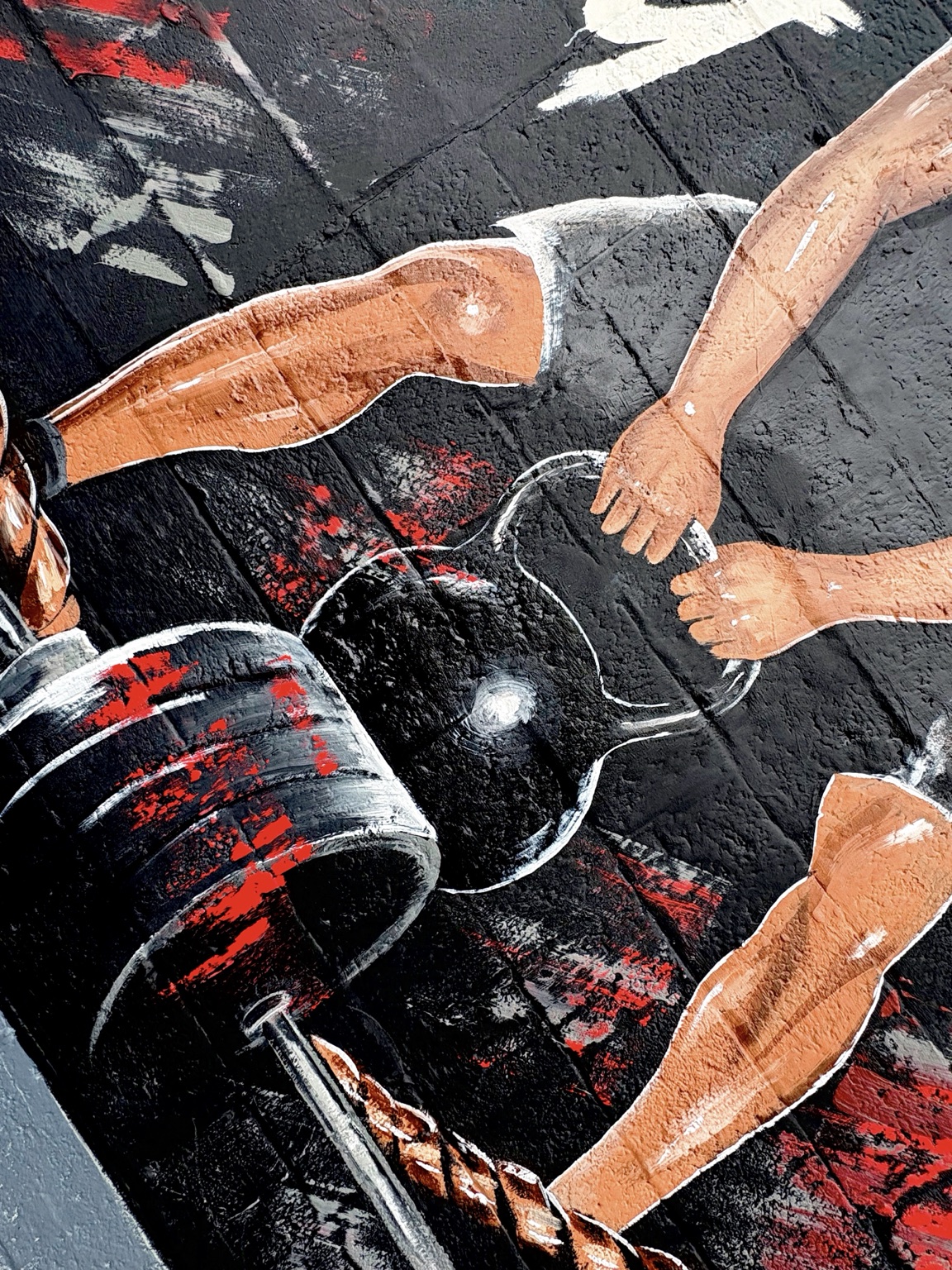 Detail of athletes and gym equipment in the mural